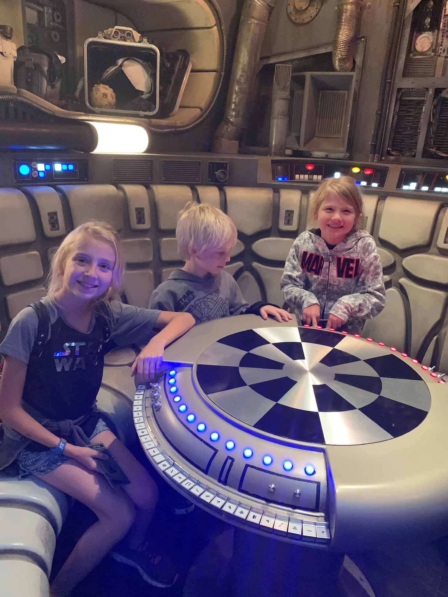 3 kids inside the Star Wars Galaxy Edge at Disney World